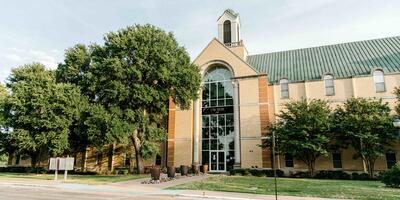 Exterior of Miller Hall which has two colors of brick and a large window in the front