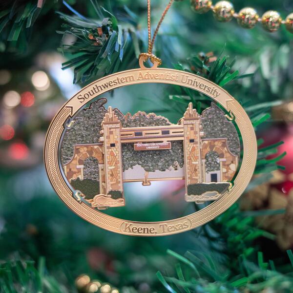 Christmas ornament designed like the Mizpah Gate hanging on a Christmas tree