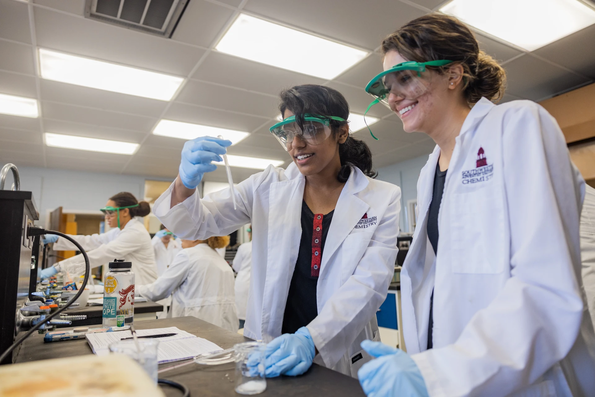 SWAU students in chemistry lab smiling learning