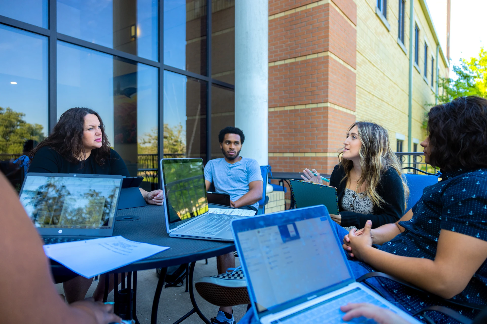 SWAU students with professor outside Pechero Patio