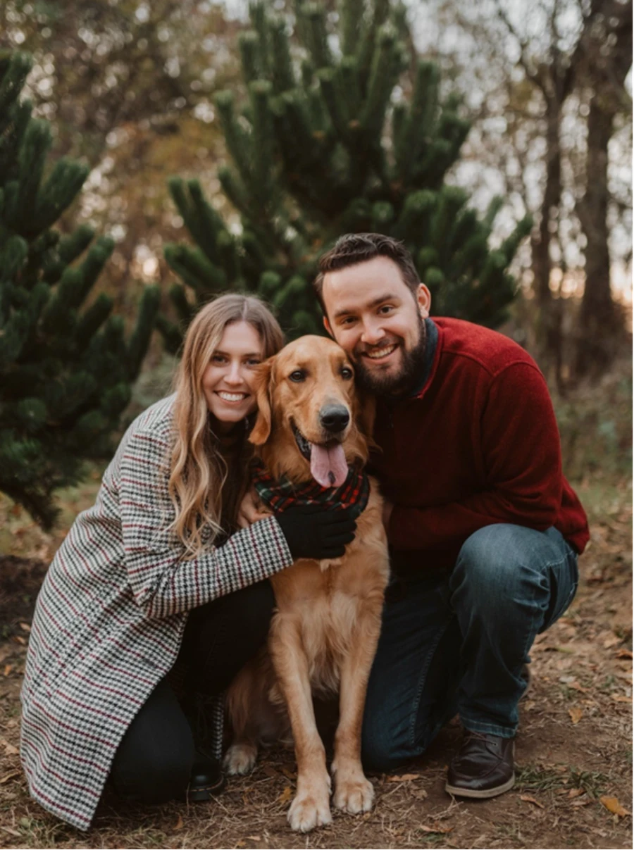 A woman and man with a dog 