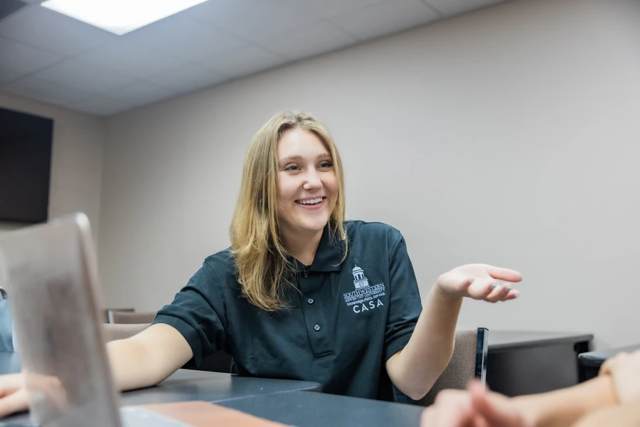 Center of Academic Success and Advising SWAU coach smiling